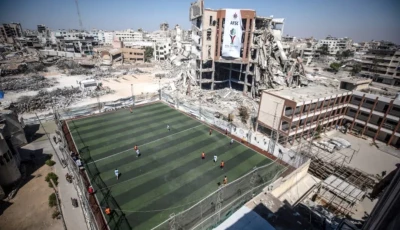 a football pitch amid the rubble in gaza city photo afp