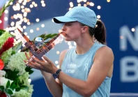 iga swiatek poses with her trophy after defeating kazakhstan s elena rybakina in a national bank open final tennis match in toronto photo afp