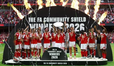 martin odegaard lifts the trophy as he celebrates with team mates after winning the fa community shield at the principality stadium in cardiff photo reuters