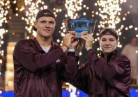 czech republic s jakub mensik and karolina muchova hold up the trophy after winning the mixed doubles final match of the 2026 us open photo afp