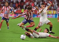 rodrigo mendoza left is challenged by sevilla s spanish defender 04 kike salas during the spanish league football match photo afp