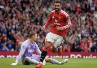 bruno fernandes turns away to celebrate after scoring his side s fourth goal to complete his hat trick against ipswich photo afp