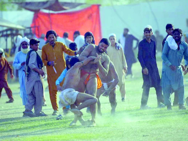 two wrestlers lock horns in a traditional kushti match during the derajat festival in dera ismail khan the festival also features traditional sports such as tent pegging kabaddi and horse racing photo express two wrestlers lock horns in a traditional kushti match during the derajat festival in dera ismail khan the festival also features traditional sports such as tent pegging kabaddi and horse racing photo express