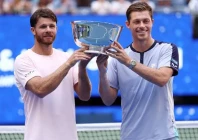 christian harrison left and neal skupski pose with their trophy after winning the men s doubles final match of the us open photo afp