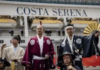 members of the nagoya omotenashi bushotai traditional samurai performance group welcome the costa serena cruise ship following its arrival in nagoya to house athletes at the asian games photo afp