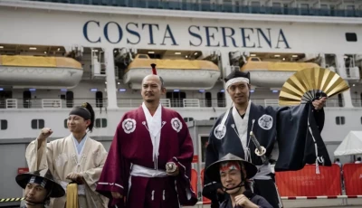 members of the nagoya omotenashi bushotai traditional samurai performance group welcome the costa serena cruise ship following its arrival in nagoya to house athletes at the asian games photo afp