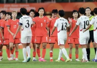 south korean women footballers and north korean players exchange high fives after their women s football group stage match ended in a 1 1 draw in japan photo afp