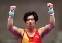 china s boheng zhang celebrates after his horizontal bar to win gold in the men s team final photo reuters