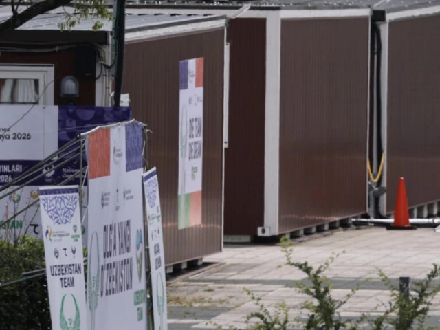 a man walks past temporary container huts being used to house athletes for the 2026 asian games at the garden pier in nagoya photo afp a man walks past temporary container huts being used to house athletes for the 2026 asian games at the garden pier in nagoya photo afp