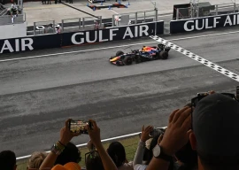 red bull racing s dutch driver max verstappen crosses the finish line to win the formula one bahrain grand prix in sepang on october 4 2026 photo afp