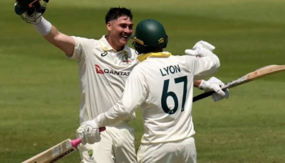 australia s matt renshaw celebrates his century with his teammate nathan lyon on day two of the first cricket test match between south africa and australia in durban photo afp