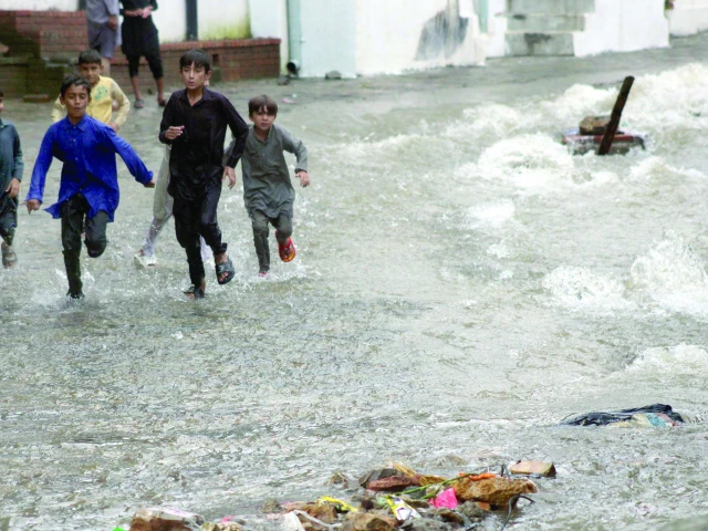 children find moments of joy chasing each other in the rain water running off a street in saidpur model village where many have suffered disruptions to normal life as heavy rain hits the twin cities continuously photo zafar raja children find moments of joy chasing each other in the rain water running off a street in saidpur model village where many have suffered disruptions to normal life as heavy rain hits the twin cities continuously photo zafar raja