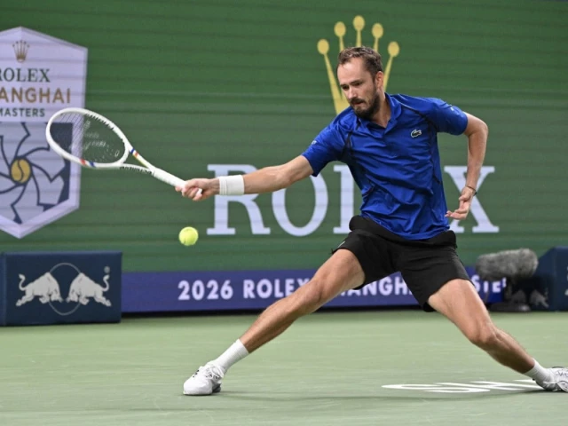 russia s daniil medvedev hits a return to greece s stefanos tsitsipas during their men s singles match at the shanghai masters tennis tournament photo afp russia s daniil medvedev hits a return to greece s stefanos tsitsipas during their men s singles match at the shanghai masters tennis tournament photo afp