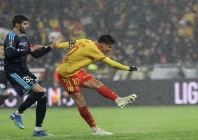 rc lens florian thauvin shoots to score against paris fc during their ligue 1 match at stade bollaert delelis in lens photo afp