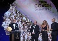luis de la fuente of spain receives the trophy for winning the 2026 men s coach of the year during the ballon d or ceremony at the london palladium theatre in london england photo afp