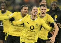 borussia dortmund midfielder marcel sabitzer centre celebrates after scoring the winner against werder bremen photo afp