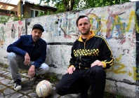members of bosnian hip hop band dubioza kolektiv brano jakubovic l and vedran mujagicpose with a ball in sarajevo on june 2 2026 photo afp