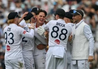 england s sonny baker 3rd l celebrates the dismissal of new zealand s rachin ravindra photo afp