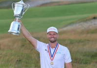 wyndham clark holds trophy aloft after winning the 126th us open at shinnecock for his second us open title in four years photo afp