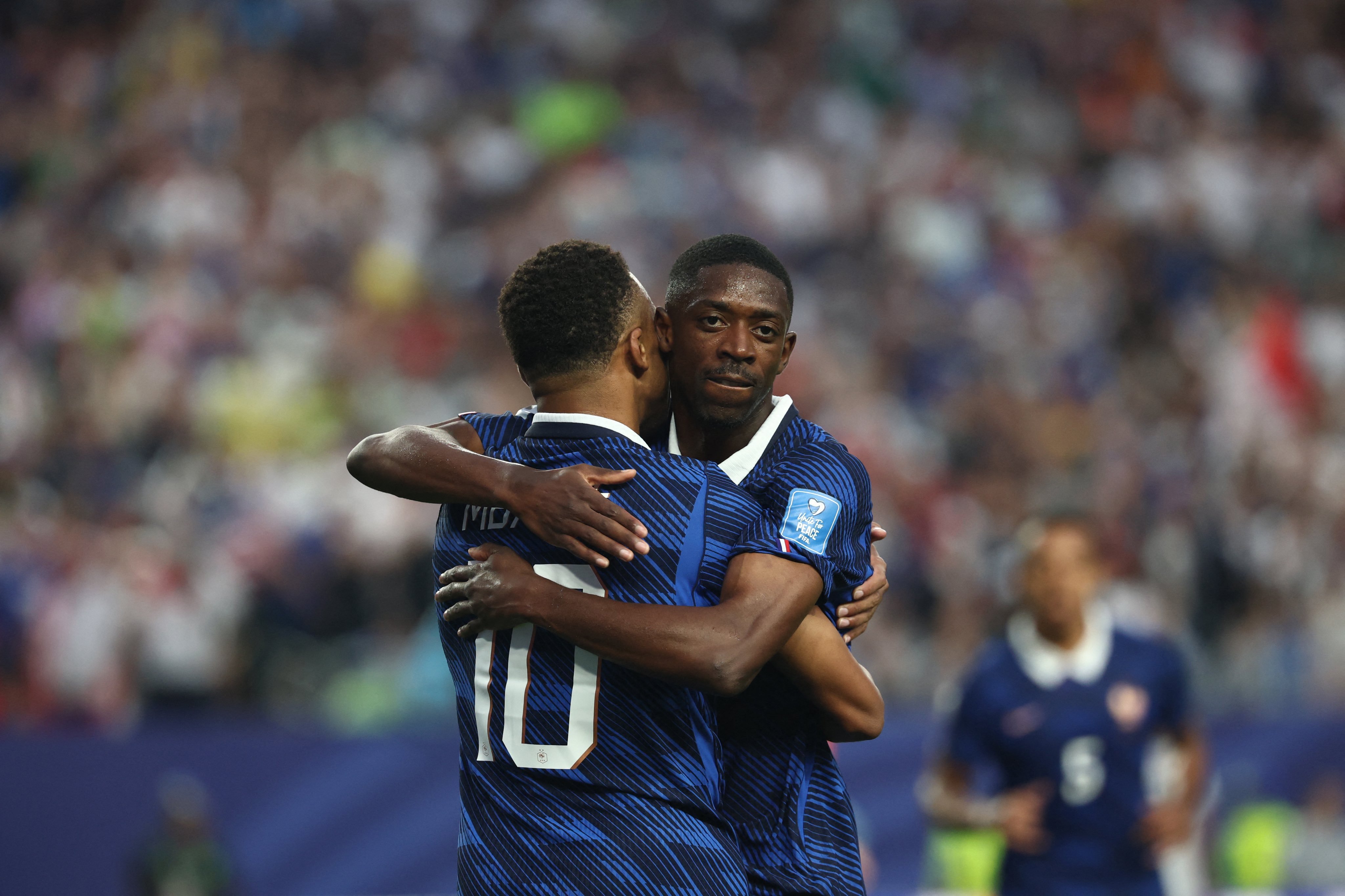 Mbappe hits double as France beat Iraq after long storm delay