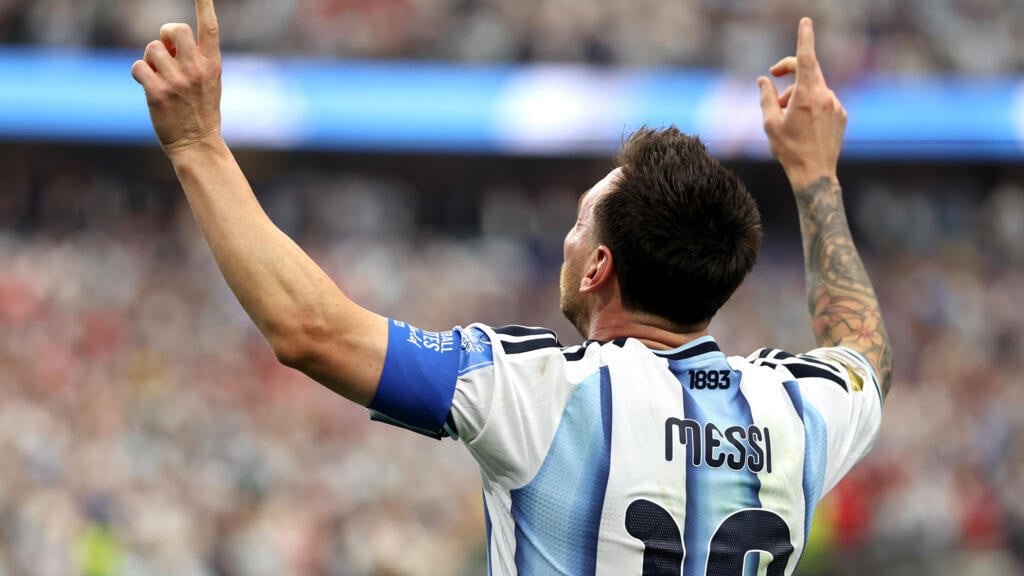 Messi sends Argentina through with record-breaking double against Austria