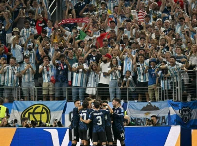 messi scores again as argentina head into last 32