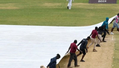 ground staff pull on the covers during the fifth and final day of the second test between sri lanka and west indies photo afp file