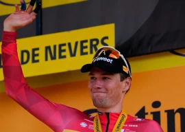 norway s soren waerenskjold celebrates on the podium after winning the 11th stage of the tour de france with the start in vichy and the finish in nevers photo afp