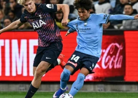 lucas bergvall left tussles for the ball after starting for tottenham in the 1 1 draw with sydney fc photo afp