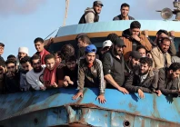 rescued refugees and migrants stand aboard a boat at the town of paleochora southwestern crete island on november 22 2022 following a rescue operation photo afp