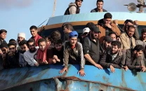 coastguard rescue 52 migrants off greece boy missing