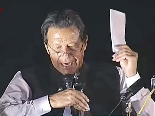former prime minister imran khan publicly displaying the purported us cypher during a public gathering screengrab former prime minister imran khan publicly displaying the purported us cypher during a public gathering screengrab