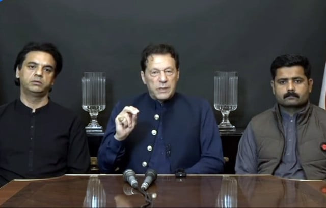 former prime minister imran khan flanked by pti leader usman dar and watchman javed ali addressing a press conference screengrab