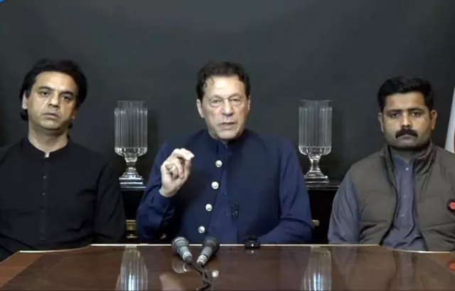 former prime minister imran khan flanked by pti leader usman dar and watchman javed ali addressing a press conference screengrab former prime minister imran khan flanked by pti leader usman dar and watchman javed ali addressing a press conference screengrab