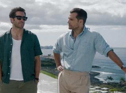 henry cavill and jake gyllenhaal lead private army battle in first in the grey trailer