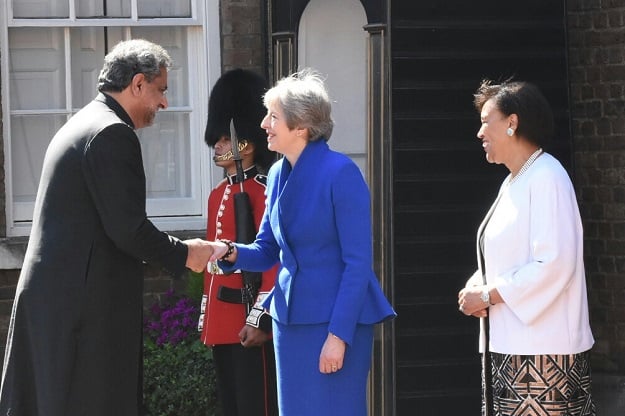 Prime Minister Shahid Khaqan Abbasi greets British PM May. PHOTO: PM OFFICE