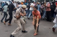 police use batons to disperse supporters of the cockroach janta party as they march toward parliament on the opening day of its monsoon session demanding the resignation of education minister dharmendra pradhan over exam paper leaks in new delhi india july 20 2026 photo reuters