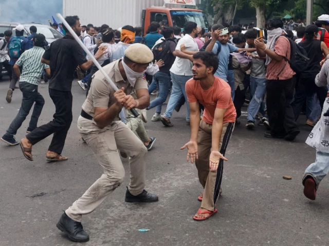 police use batons to disperse supporters of the cockroach janta party as they march toward parliament on the opening day of its monsoon session demanding the resignation of education minister dharmendra pradhan over exam paper leaks in new delhi india july 20 2026 photo reuters police use batons to disperse supporters of the cockroach janta party as they march toward parliament on the opening day of its monsoon session demanding the resignation of education minister dharmendra pradhan over exam paper leaks in new delhi india july 20 2026 photo reuters