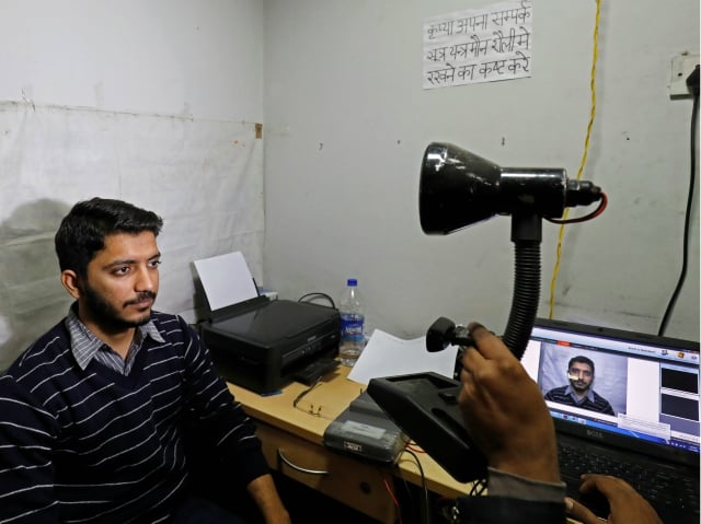 A man goes through the process of eye scanning for the Unique Identification (UID) database system, also known as Aadhaar, at a registration centre in New Delhi. PHOTO: Reuters