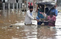 residents wade through a flooded street following heavy monsoon rains in guwahati india on august 4 2026 photo afp file