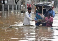 residents wade through a flooded street following heavy monsoon rains in guwahati india on august 4 2026 photo afp file
