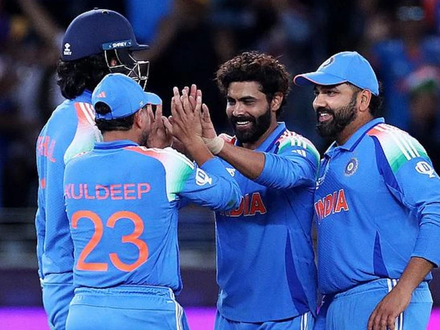 india s ravindra jadeja celebrates with teammates after taking the lbw wicket of new zealand s tom latham photo reuters