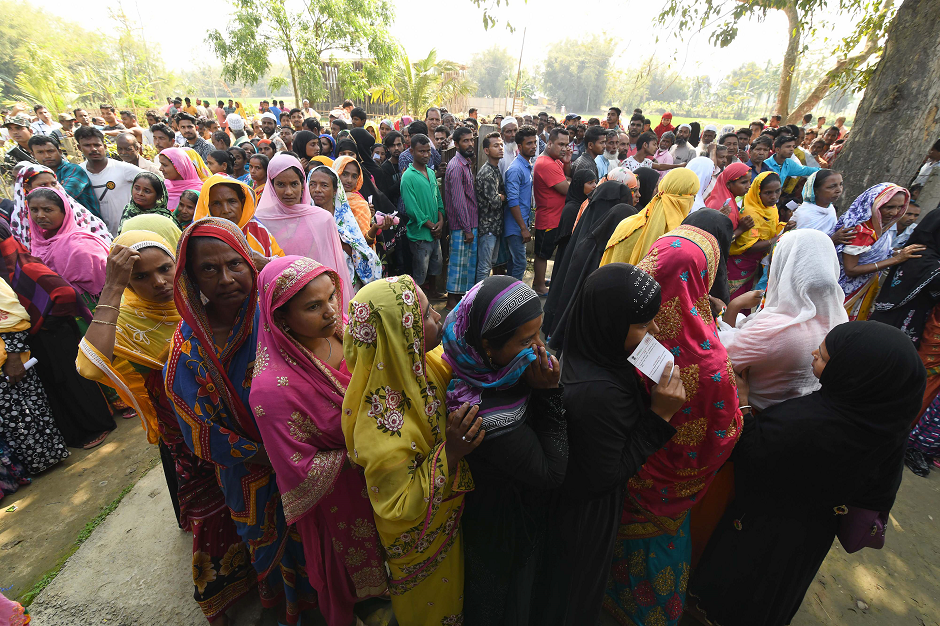 Indian voters queue to cast their vote at a polling station during India's general election in Samuguri, some 155 km from Guwahati, the capital city of India's northeastern state of Assam, on April 11, 2019. PHOTO: AFP