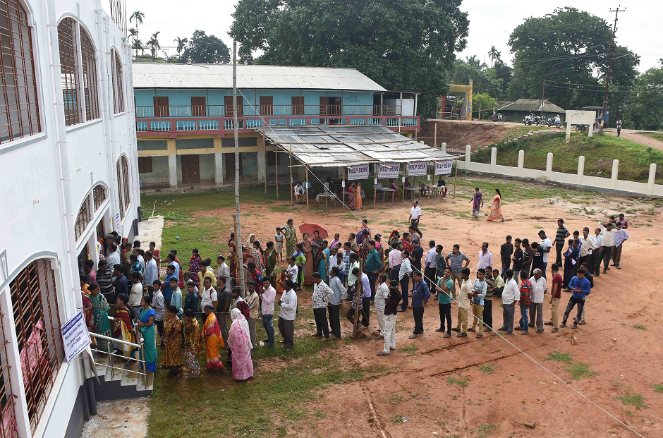 Indian voters stand in a queue to cast their vote at a polling station during India's general election in Agartala, the capital of northeastern state of Tripura, on April 11, 2019. PHOTO: AFP