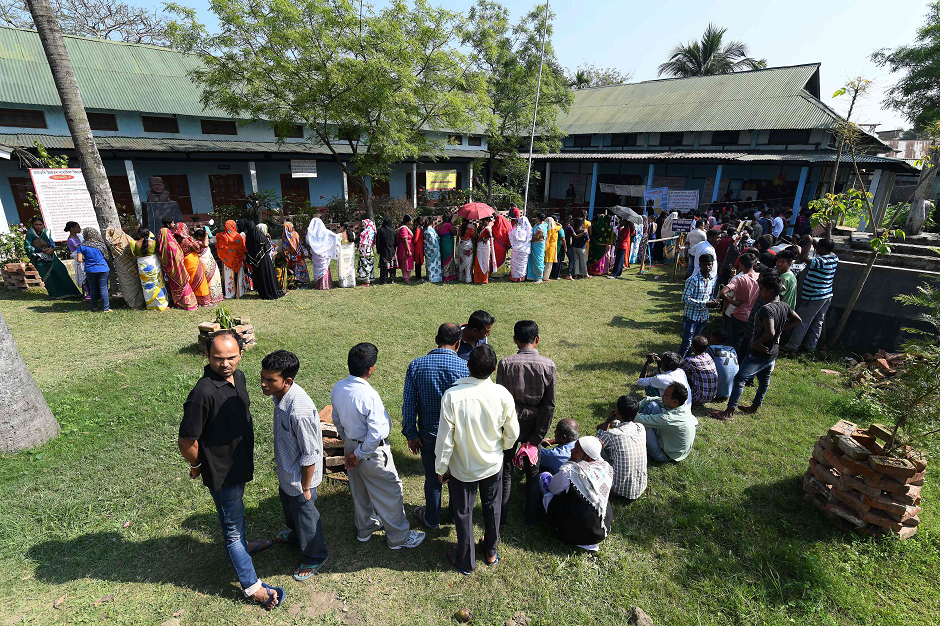 Indian voters queue to cast their vote at a polling station during India's general election in Samuguri, some 155 km from Guwahati, the capital city of India s northeastern state of Assam, on April 11, 2019. PHOTO: AFP