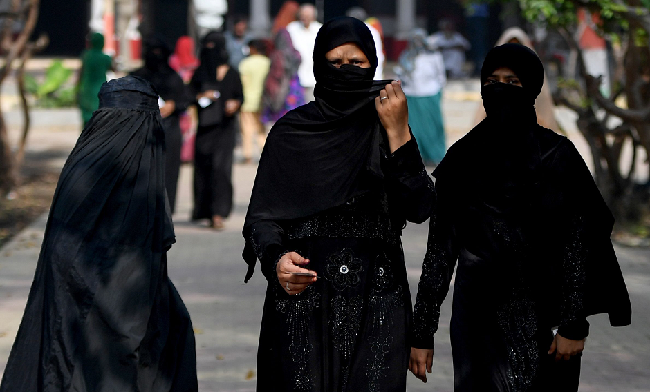 Indian women walk back after casting their vote at a polling station during the India's general election in Kawaal village near Muzaffarnagar, in the northern Indian state of Uttar Pradesh, on April 11, 2019. PHOTO: AFP