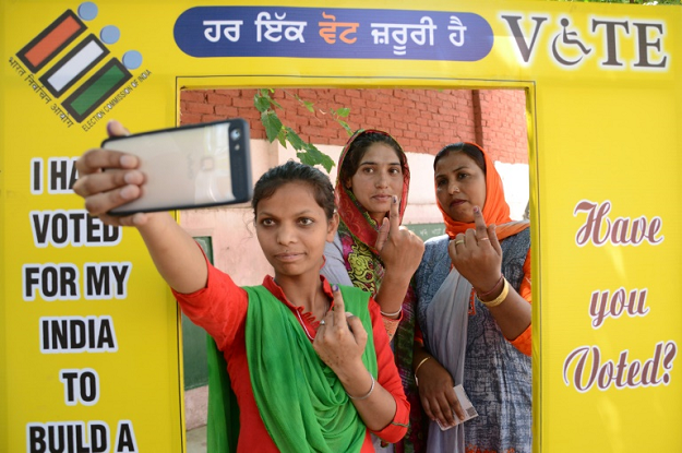 the vote increasingly became a personal referendum on one of India's most popular and divisive prime ministers ever. PHOTO: AFP