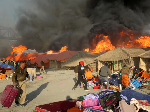 police officers and volunteers salvage belongings of the devotees after a fire erupts in makeshift tents during the ongoing maha kumbh mela or the great pitcher festival in prayagraj india january 19 2025 photo reuters