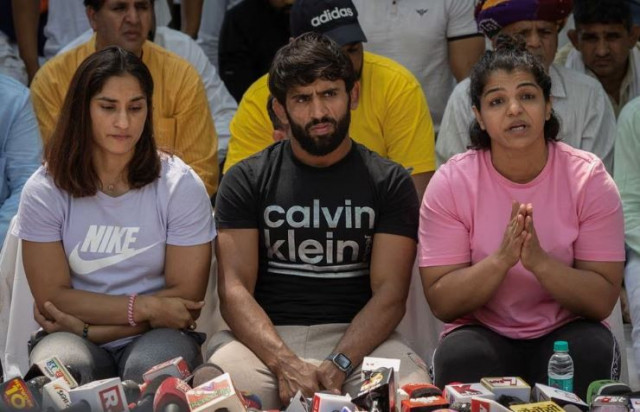 indian wrestlers vinesh phogat bajrang punia and sakshi malik address a news conference as they take part in a sit in protest demanding arrest of wrestling federation of india wfi chief in new delhi india april 24 2023 photo reuters indian wrestlers vinesh phogat bajrang punia and sakshi malik address a news conference as they take part in a sit in protest demanding arrest of wrestling federation of india wfi chief in new delhi india april 24 2023 photo reuters
