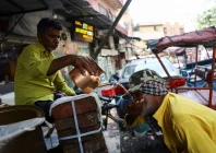 a cycle rickshaw puller drinks water distributed for free by mohammed hasin on a street on a hot summer day in old delhi india may 22 2026 photo reuters